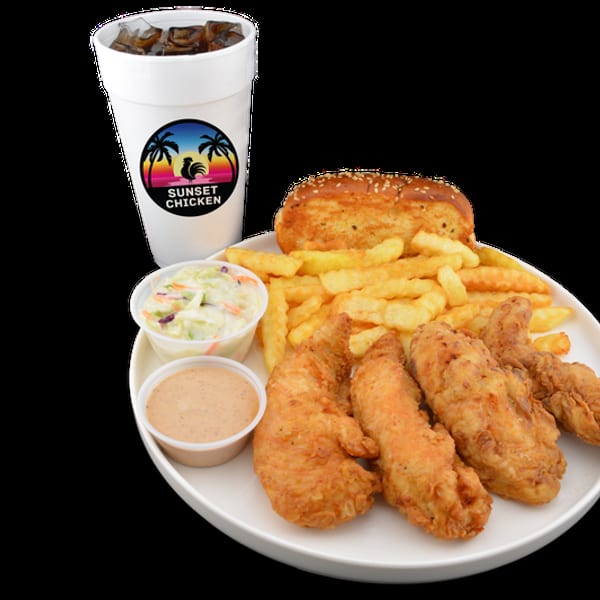 Sunset Chicken meal with fried chicken tenders, fries, coleslaw, dipping sauce, and a drink.
